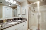 Secondary bath has large shower and ample counter top space. Located across the hall from second bedroom